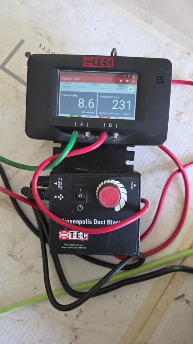 DG-1000 gauge and fan controller during a duct leakage test