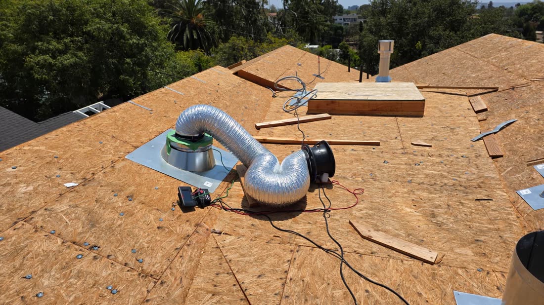 Duct Blaster on a new-construction roof overlooking Los Angeles